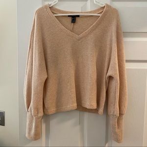 SLIGHTLY cropped v neck sweater. Super soft.